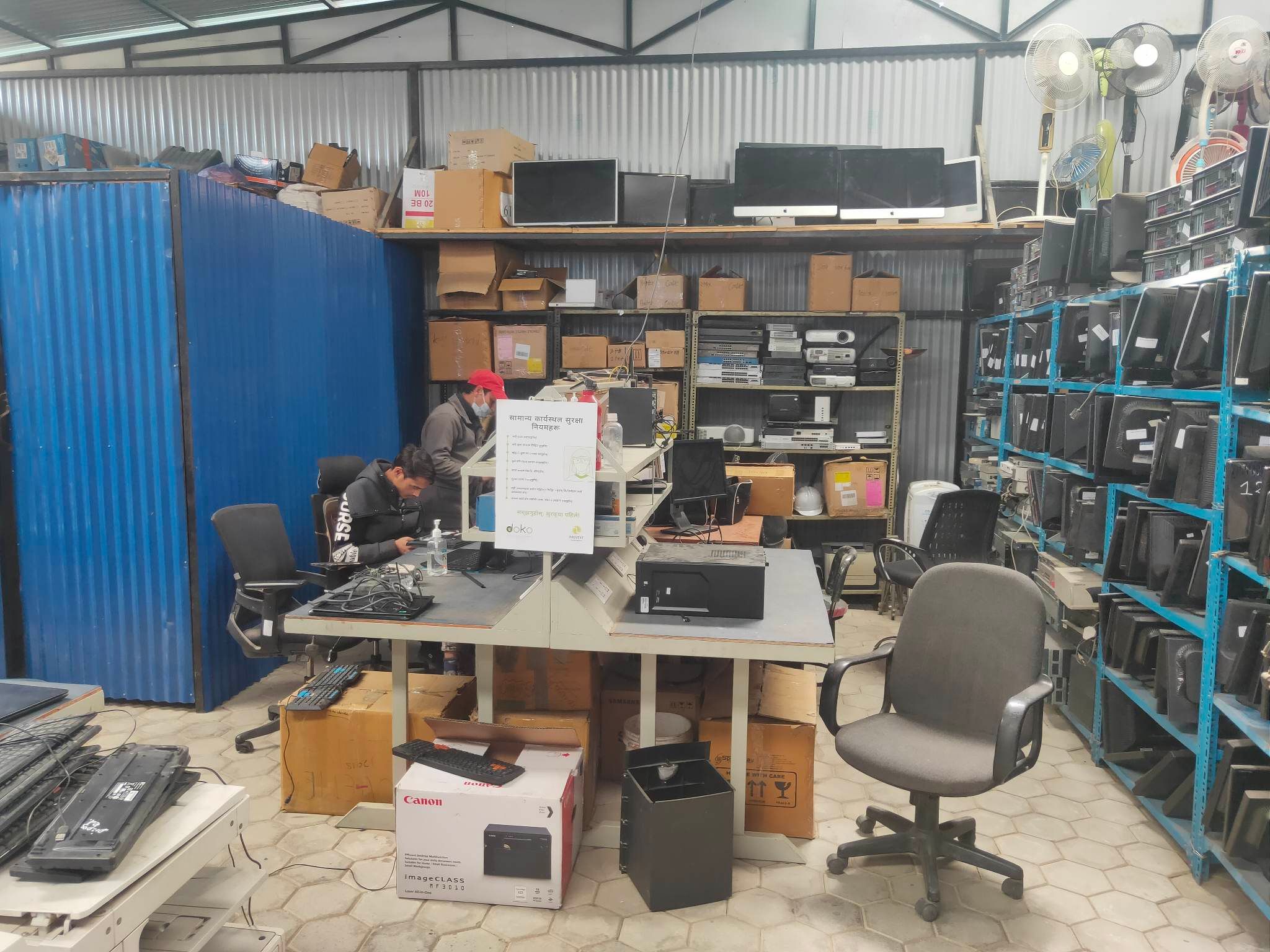 doko sorting and restoring e-waste